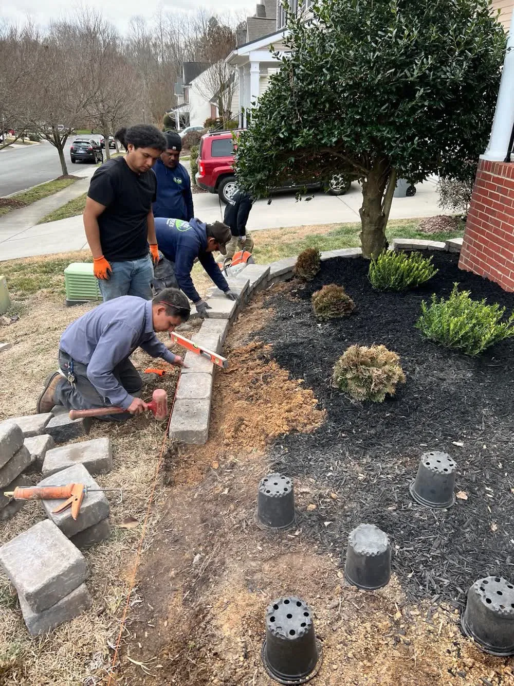 Crew installing paver edging
