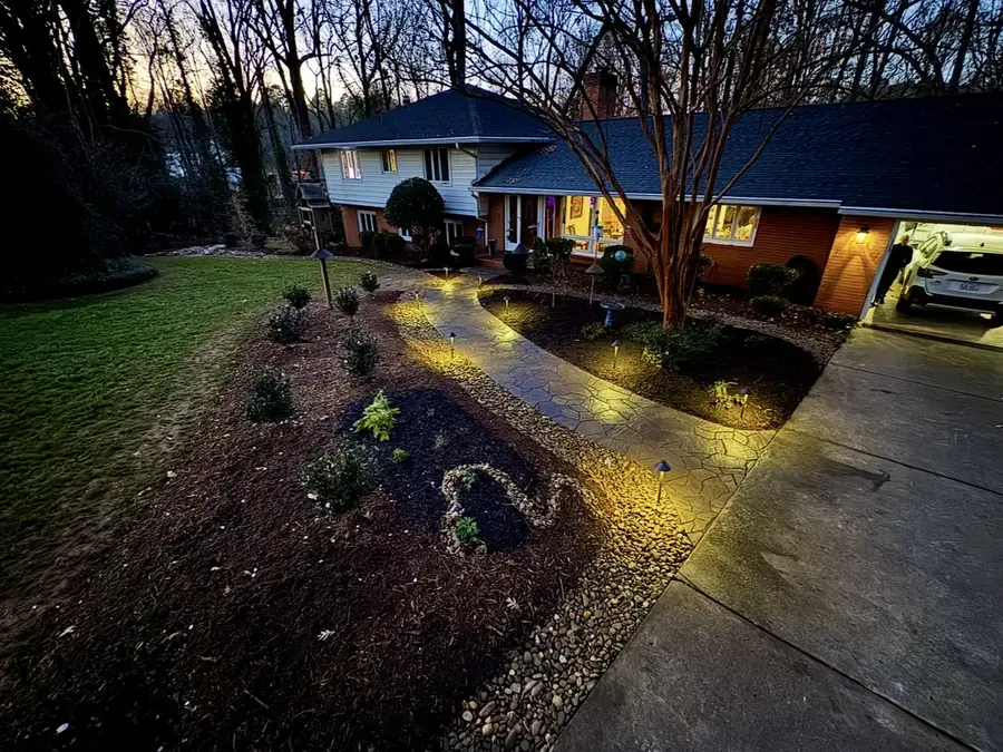 Front yard landscape lighting at dusk